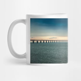 In the colorful evening light lies the Öresund Bridge, which connects Sweden and Denmark Mug